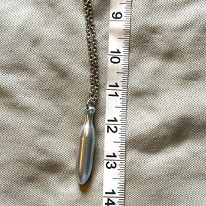 Bullet shaped essential oil roller ball necklace.